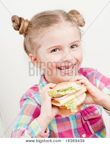 Little girl with big sandwich