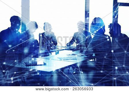 Silhouette Of Business People Work Together In Office. Concept Of Teamwork And Partnership. Double E