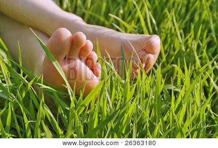 bare feet in green grass