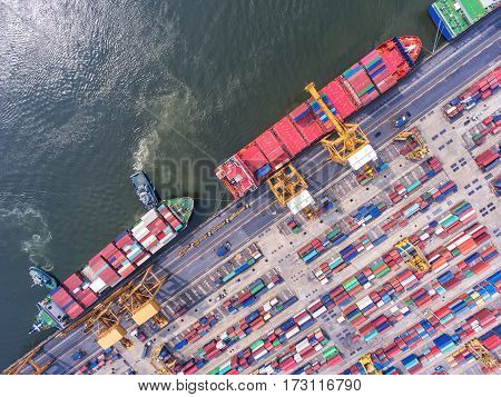 container ship in import export and business logistic.By crane Trade Port Shipping.cargo to harbor.Aerial view.Water transport.International.Shell Marine.Top view.