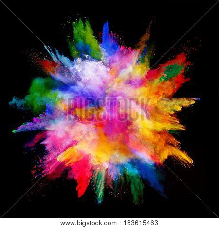 Explosion of colored powder, isolated on black background. Power and art concept, abstract blast of colors.