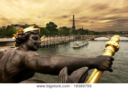 View on Seine River and Eiffel Tower from Alexander III bridge (pont Alexandre III) in Paris, France.