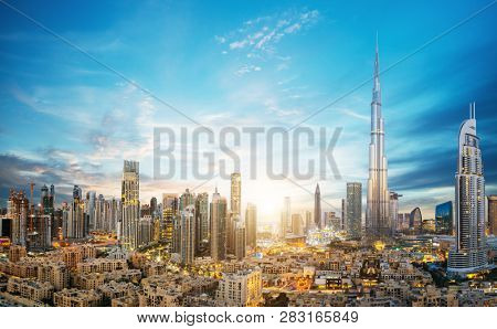 Dubai sunset panoramic view of downtown. Dubai is super modern city of UAE, cosmopolitan megalopolis.