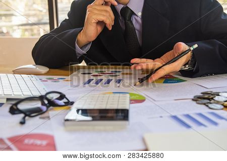 Businessman Or Accountant Working On Calculator To Calculate Business Data Concept. Accounting,inves