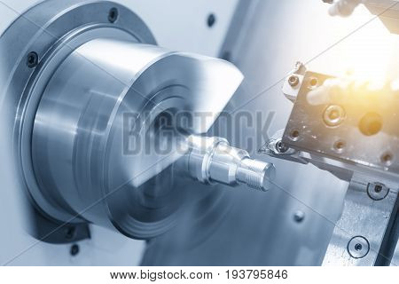 CNC lathe machine (Turning machine) cutting the metal screw thread part .Hi-precision CNC machining concept.