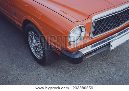 Old Restored Classic Car Parked On The Road. Restoration Of Classical Cars. New Life Of A Retro Car.