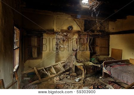 Derelict bedroom in an abandoned house in an old village in Bulgaria