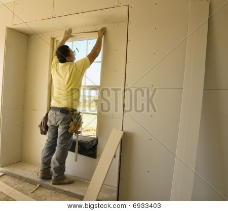 Working On The Window Sheetrock