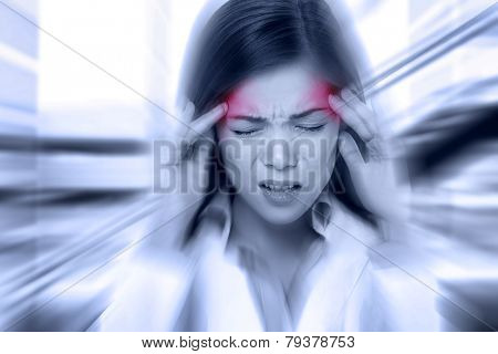 Headache migraine people - Doctor woman stressed. Woman Nurse / doctor with migraine headache overworked and stressed. Health care professional in lab coat wearing stethoscope at hospital.