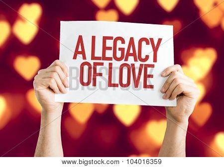 A Legacy of Love placard with heart bokeh background