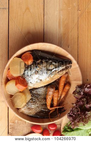 Salmon Head Cooked Of Tari Yaki Sauce With Fresh Vegetables.