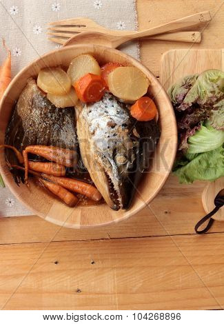 Salmon Head Cooked Of Tari Yaki Sauce With Fresh Vegetables.