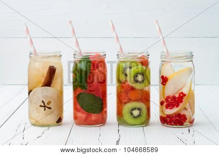 Detox fruit infused flavored water. Refreshing summer homemade cocktail. Clean eating