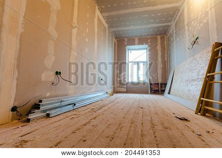 Material for repairs in an apartment is under construction remodeling rebuilding and renovation. Making walls from gypsum plasterboard or drywall.