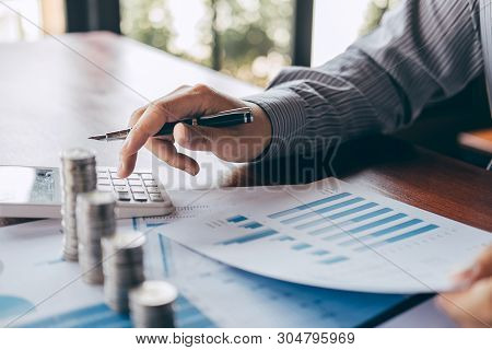 Businessman Accountant Counting Money And Making Notes At Report Doing Finances And Calculate About