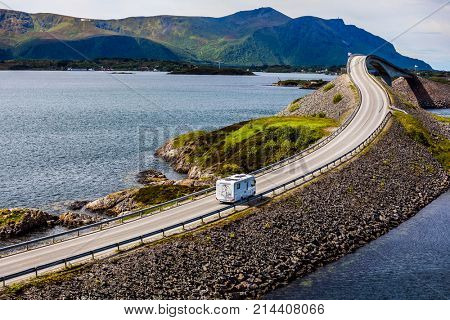 Caravan car RV travels on the highway Norway. Atlantic Ocean Road or the Atlantic Road (Atlanterhavsveien) been awarded the title as (Norwegian Construction of the Century).