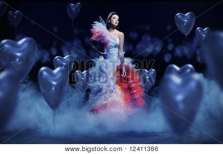 Young woman in the mist with hearts