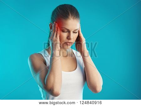 Sad female suffering from stress and pain in temples. Concept of migraine problem and treatment.