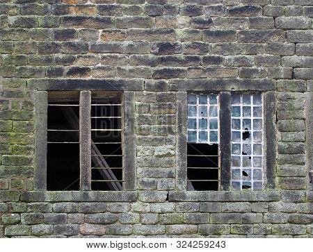 Broken Windows In An Old Derelict Stone House