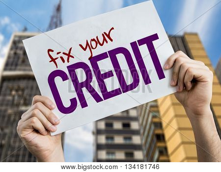 Fix Your Credit placard with cityscape background