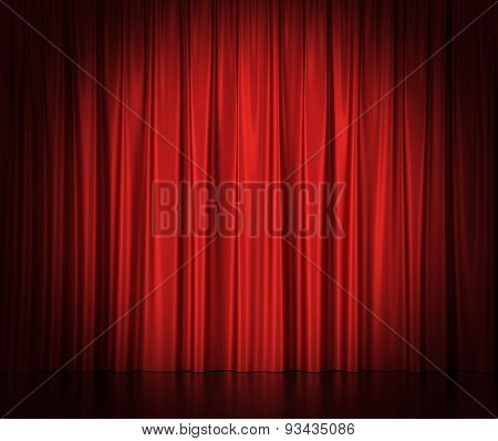 Red silk curtains for theater and cinema spotlit light in the center.