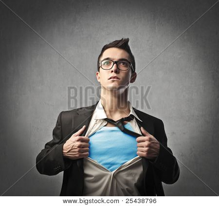 Businessman showing a superhero suit underneath his suit