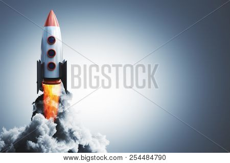 Launching Rocket On Gray Background. Startup And Begin Concept. 3d Rendering