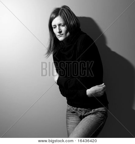 Young woman suffering from a severe stomach pain/depression/anxiety