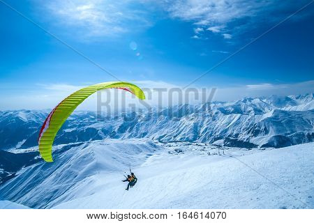 Winter in Greater Caucasus Mountains. Georgia (country). Gudauri ski resort. Paragliding