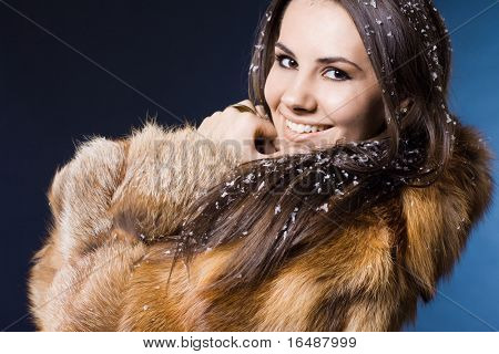 beautiful woman in a fur coat