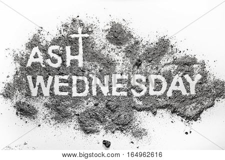 Ash wednesday word written in ash and christian cross symbol as a religion concept