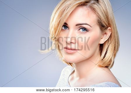 Close-up portrait of a beautiful well-groomed middle-aged woman. Skincare, rejuvenation, cosmetics.