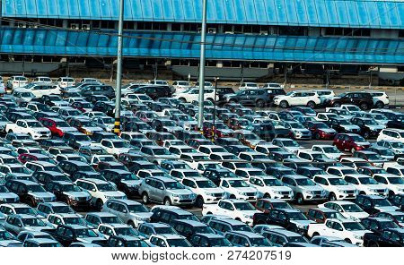 New Car Parked In A Row At Parking Lot Of Factory. Car Dealer Inventory Stock. Automotive Industry. 