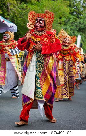 Dancer Men In Traditional Balinese Costumes And Masks Tari Wayang Topeng - Characters Of Bali Cultur