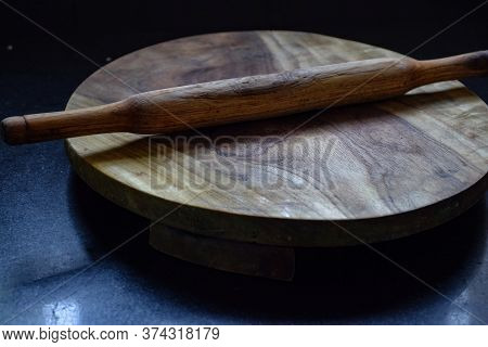 Picture Of Flat Circular Wooden Rolling Board With Rolling Pin