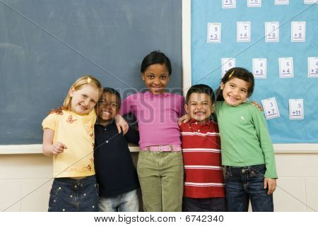 Students Standing In Classroom.