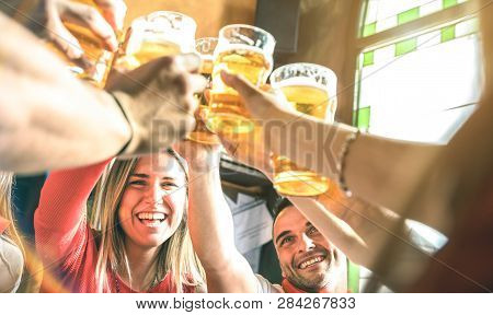 Friends Drinking And Toasting Beer At Brewery Bar Restaurant - Friendship Concept On Young Millenial