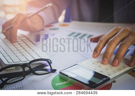 Businessman Or Accountant Working On Calculator To Calculate Business Data Concept. Accounting,inves