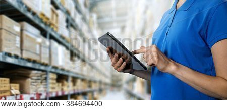 Logistics Service, Warehouse Management And Inventory Concept - Female Worker Using Digital Tablet I