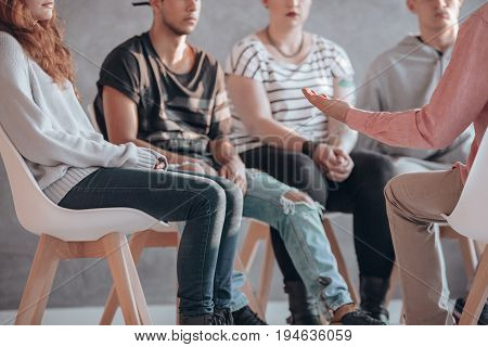 Rebellious youth being treated at a psychotherapy meeting