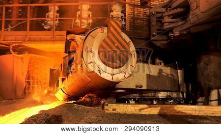 Close Up For Aluminum Melting Furnace In A Foundry Moving Backwards, Heavy Metallurgy Concept. Stock