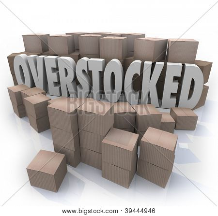 The word Overstocked in the middle of a warehouse of cardboard boxes to symbolize an oversupply or surplus of merchandise on hand