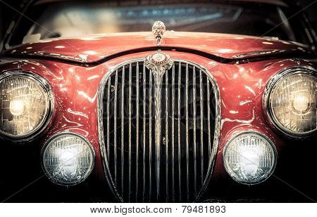 Front Headlights And Grille Of A Vintage Jaguar.