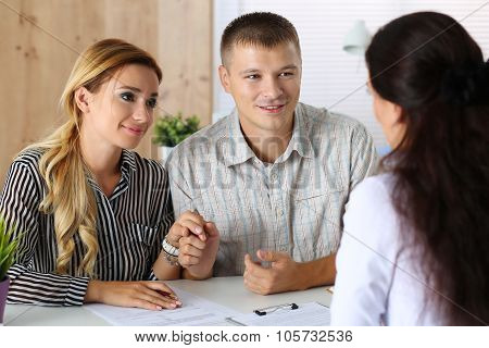 Young Family Couple Trying To Get Loan