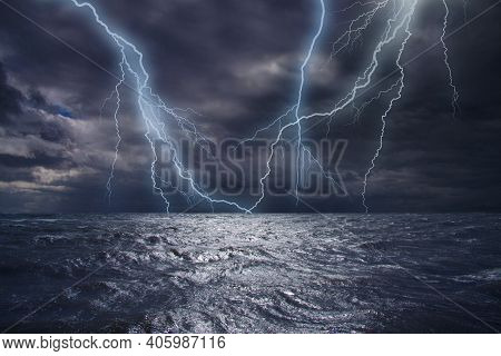 Lightning Strike Over The Ocean. Bolt Of Lightning Over Stormy Dark Sea During A Thunder-storm With 