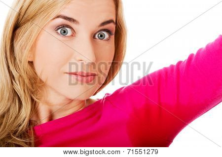 Woman sweating very badly have wet armpit