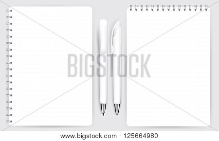 Blank realistic spiral notepad notebook and white pen isolated on white vector. Display Mock up for coporate identity and promotion objects.