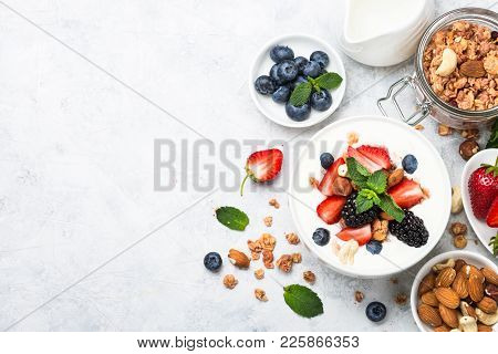 Greek Yogurt Granola With Berries Mix On Stone Table. Top View With Copy Space. Healthy Food, Snack 