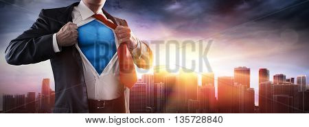 Businessman Superhero With Sunset In City-Power Concept