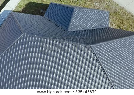 House With A Gray Metal Roof. Modern Roof Made Of Metal. Corrugated Metal Roof And Metal Roofing.